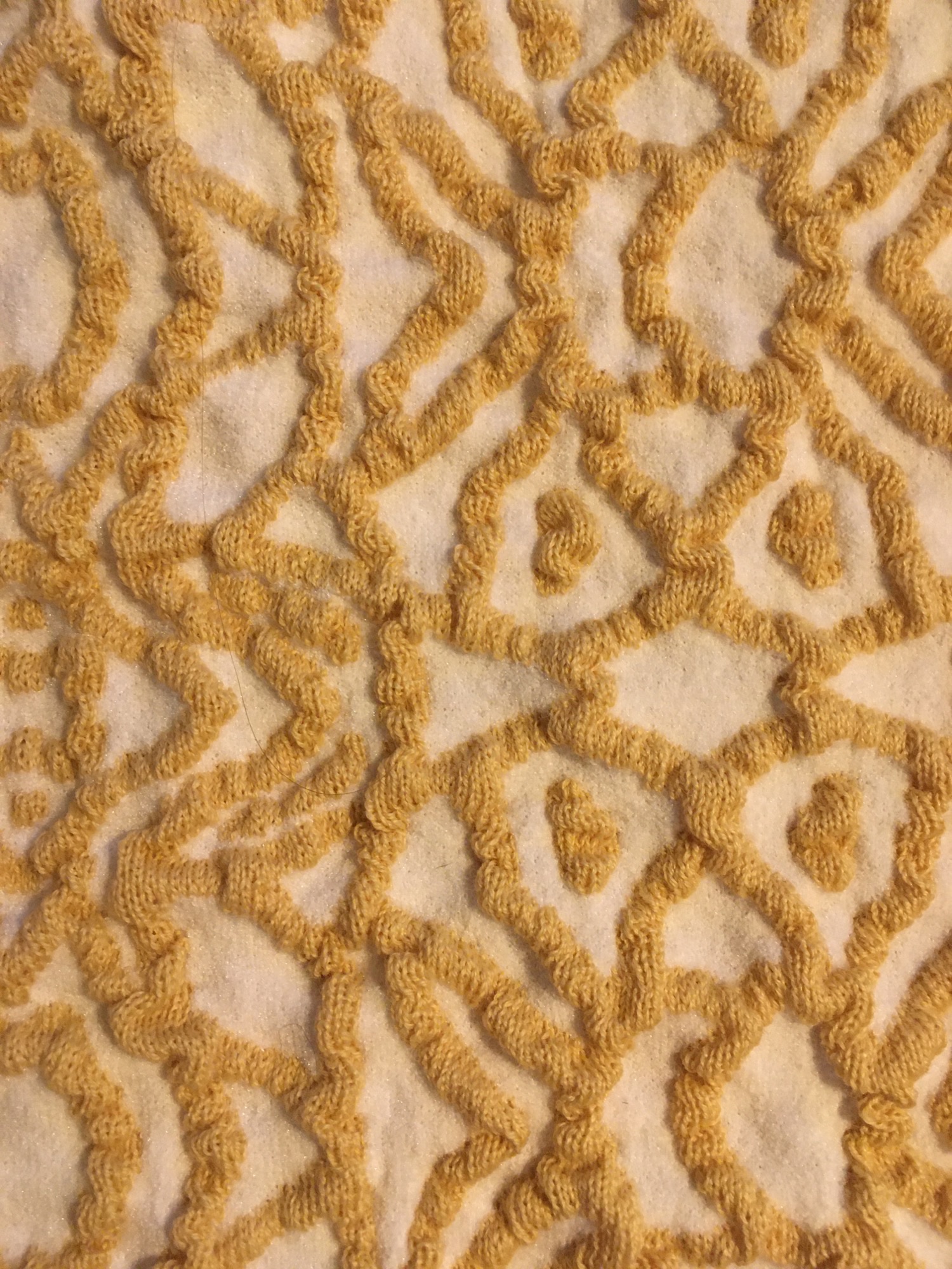 Textile design using Pemotex and steam to create a tactile surface using ordinary yarn of wool and acrylic. Made by design student Cecilie Lindskjold, VIA University College, VIA Design and Business.