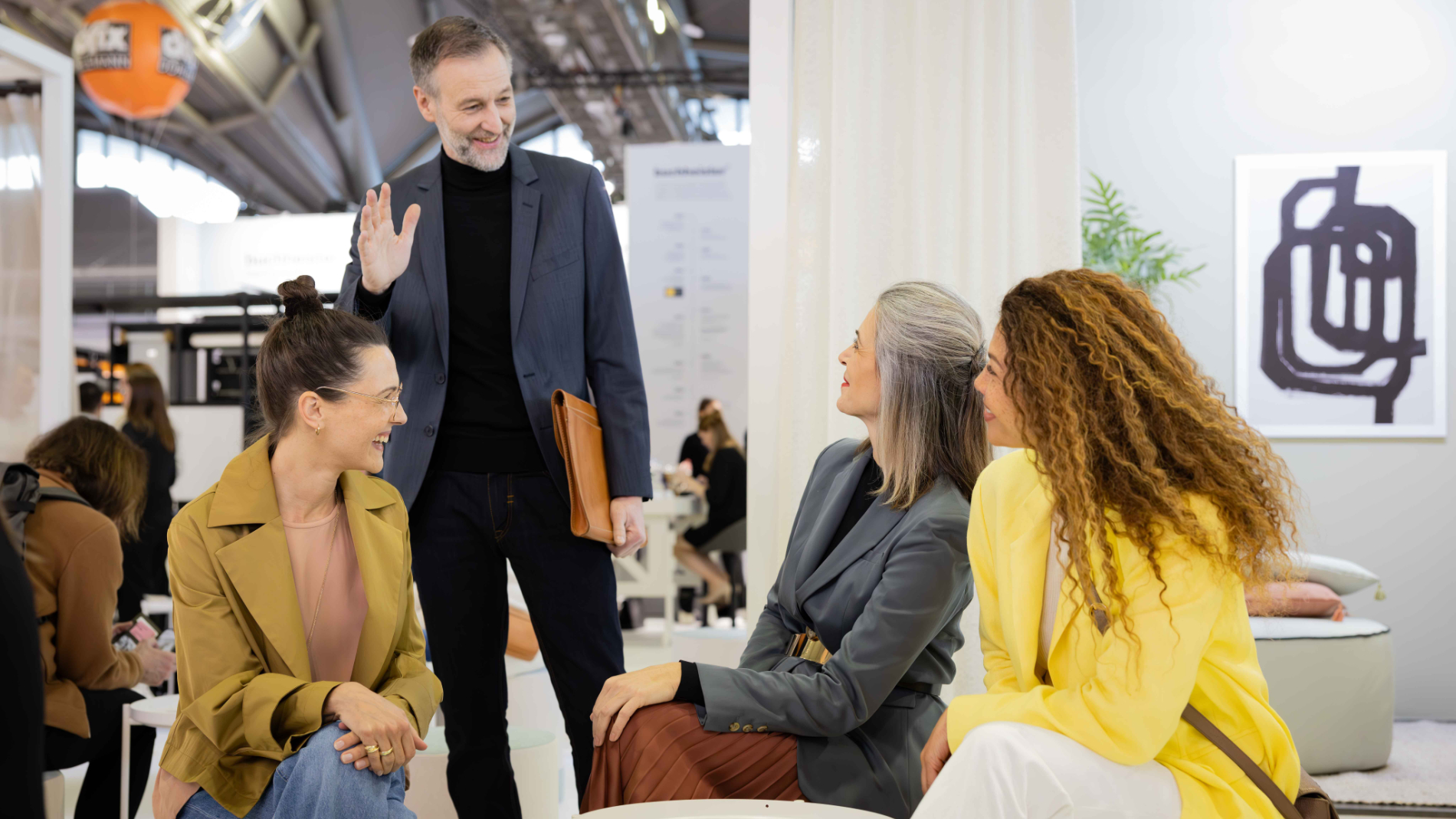Fair visitors and exhibitors talking