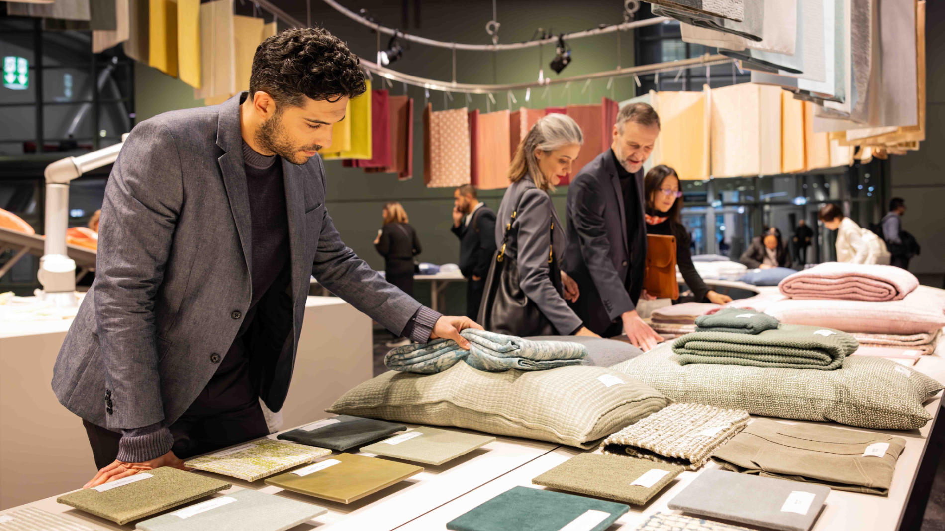 Man is looking at fabrics