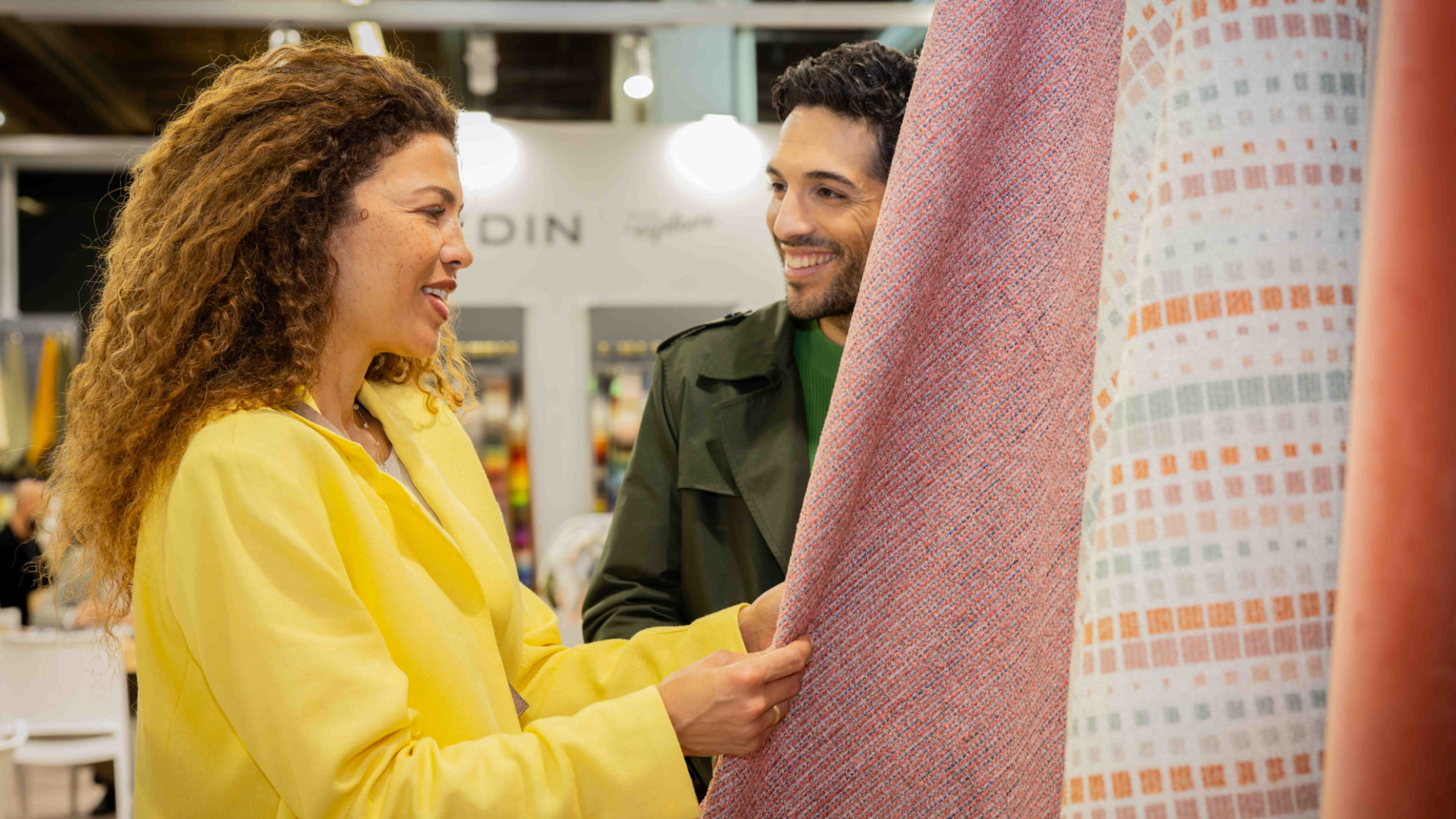 Woman looks at curtains