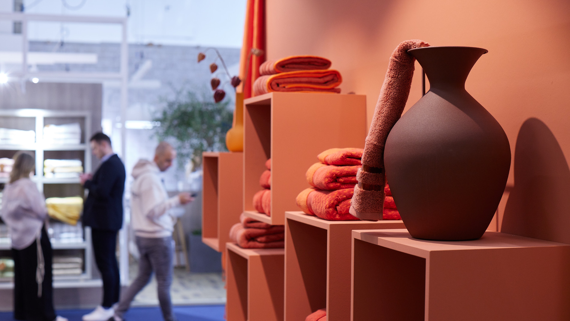 Vase and towels in red colors